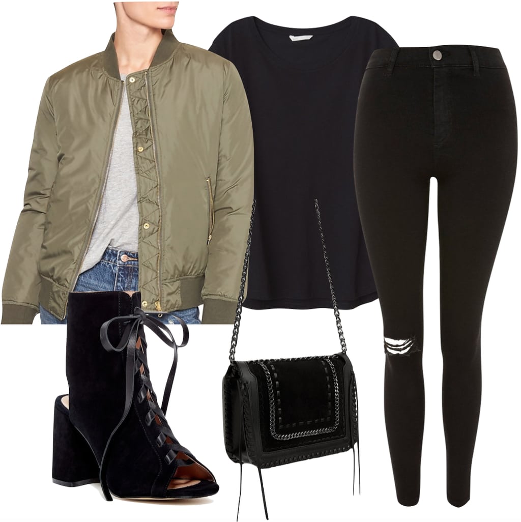 Winnie Harlow Outfit: black crew neck t-shirt, black ripped knee skinny jeans, an olive green bomber jacket, black lace-up booties, and a black leather and silver chain crossbody bag