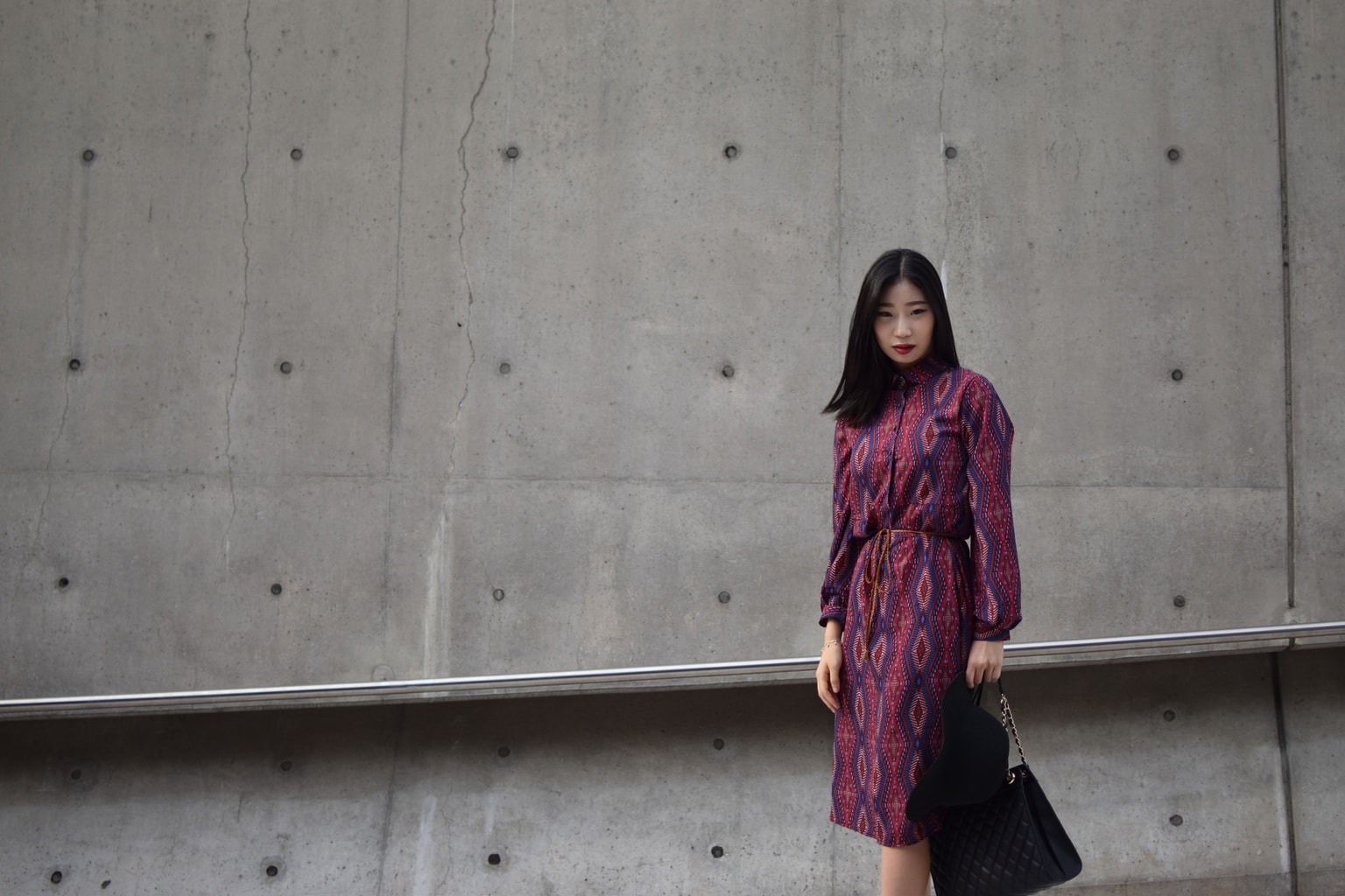 Woman wearing a long-sleeved red printed dress