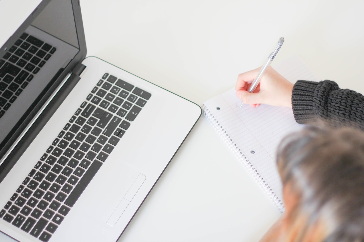 What to wear to a job or internship - woman working with a laptop