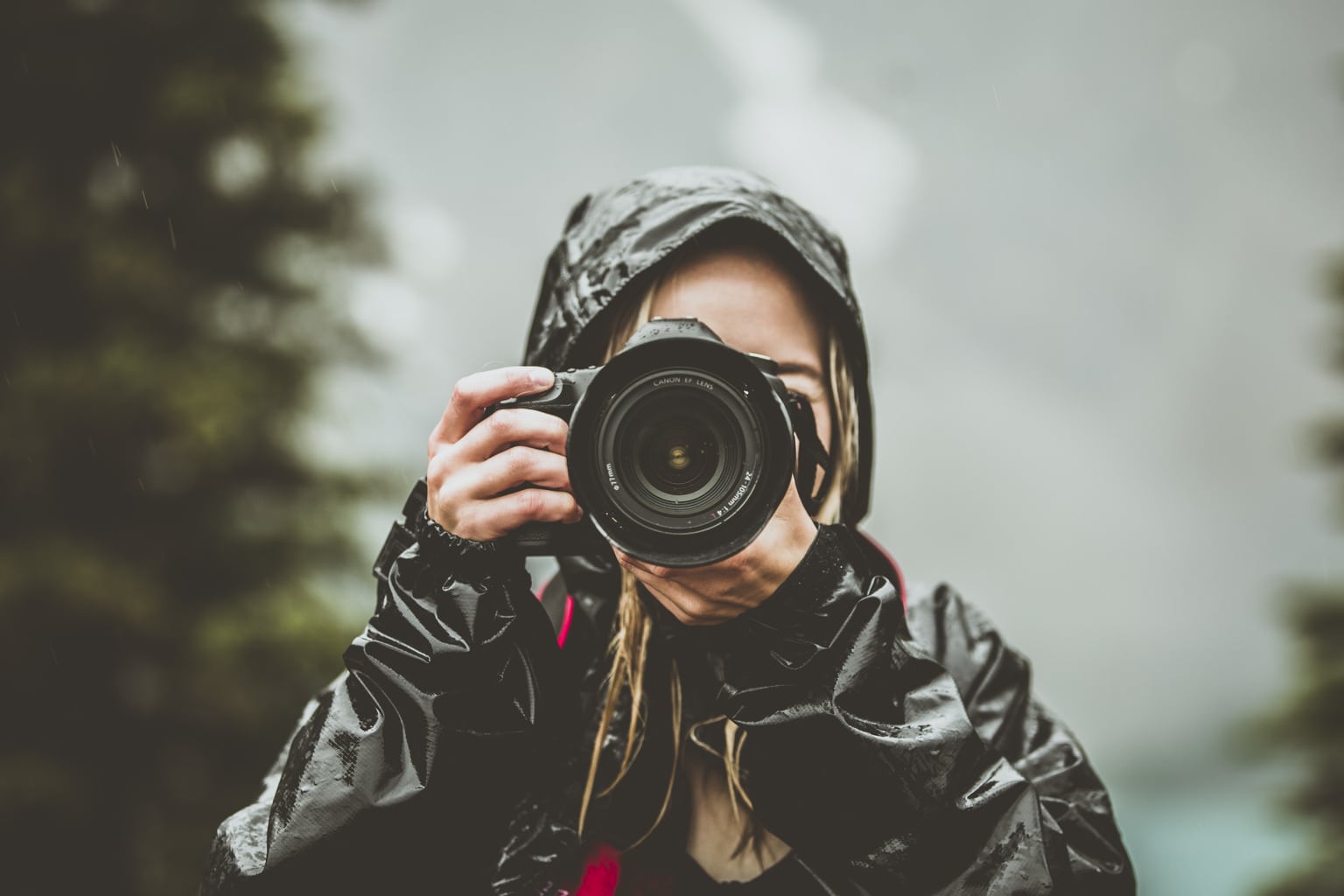 women-taking-photos-in-the-rain