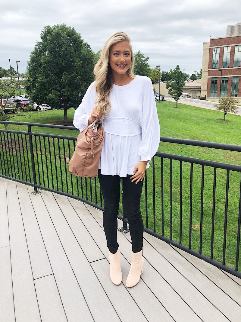 WVU student Gabriella wears a casual white tunic with bell sleeves.