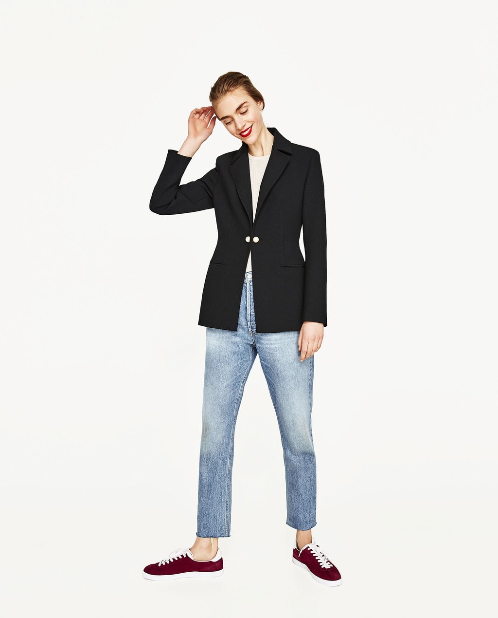 Zara black blazer with pearl closure, worn with white t-shirt, light-wash jeans, and red sneakers