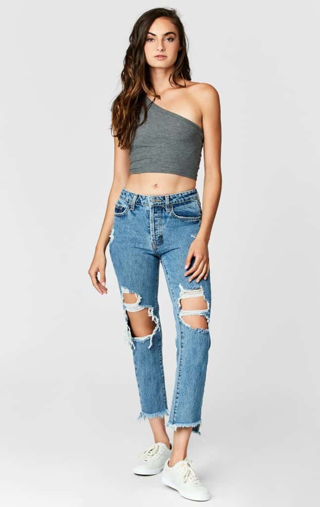 Ripped and frayed Carmar jeans. High-waisted skinny fit. 