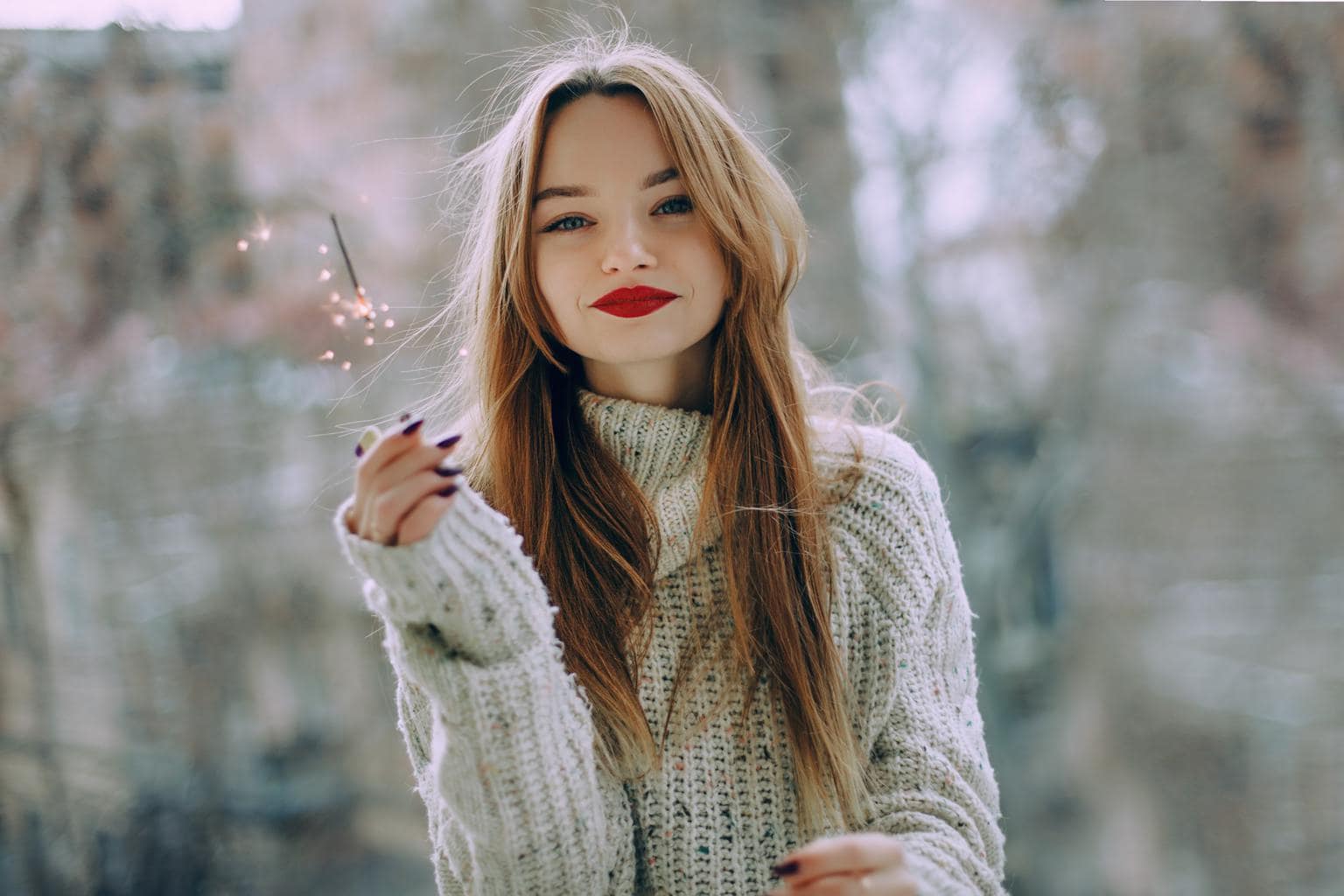Girl holding a sparkler and wearing red lipstick