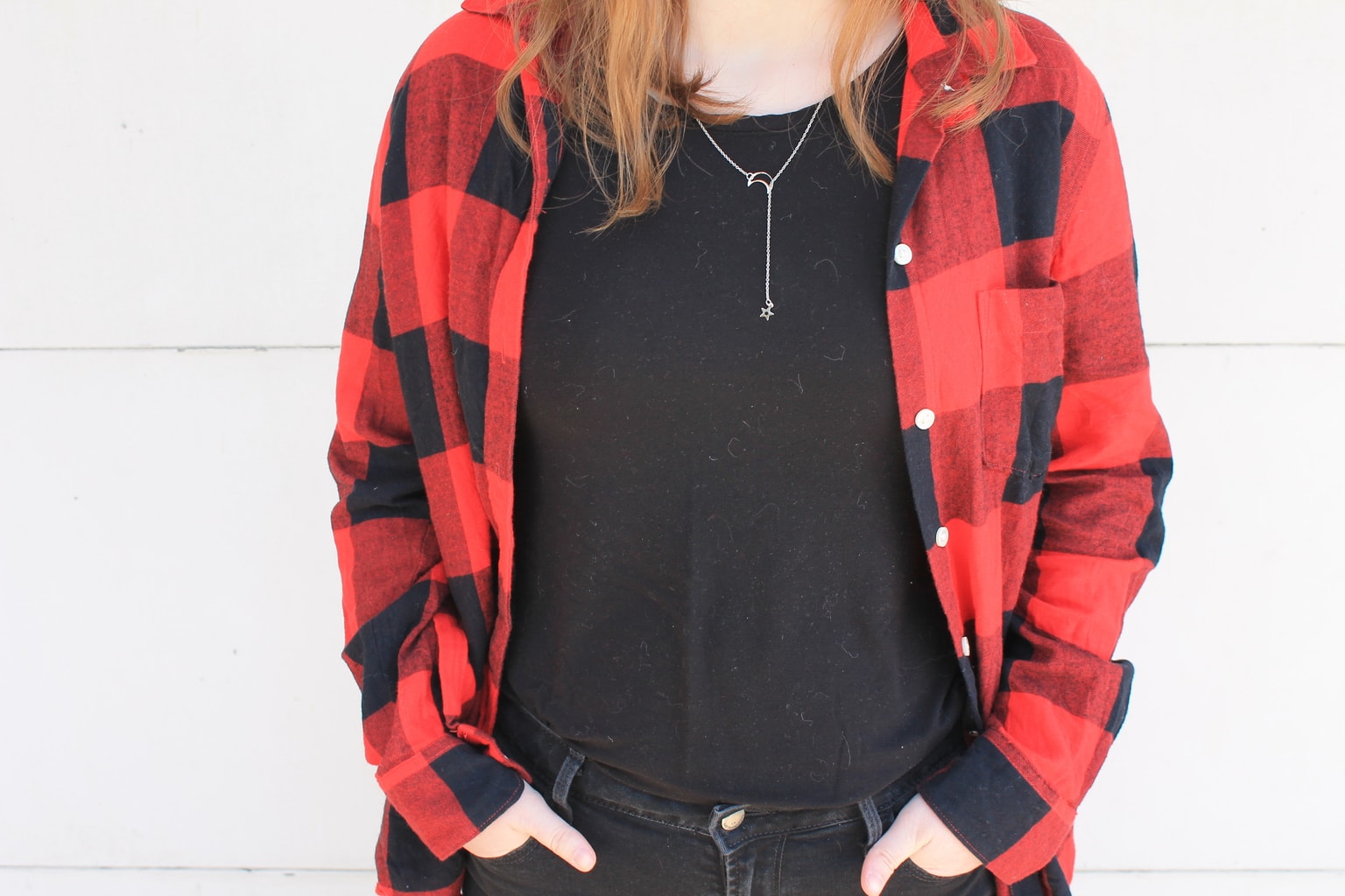 This Grand Valley State University student pairs her oversized red and black flannel with a casual black tee shirt.