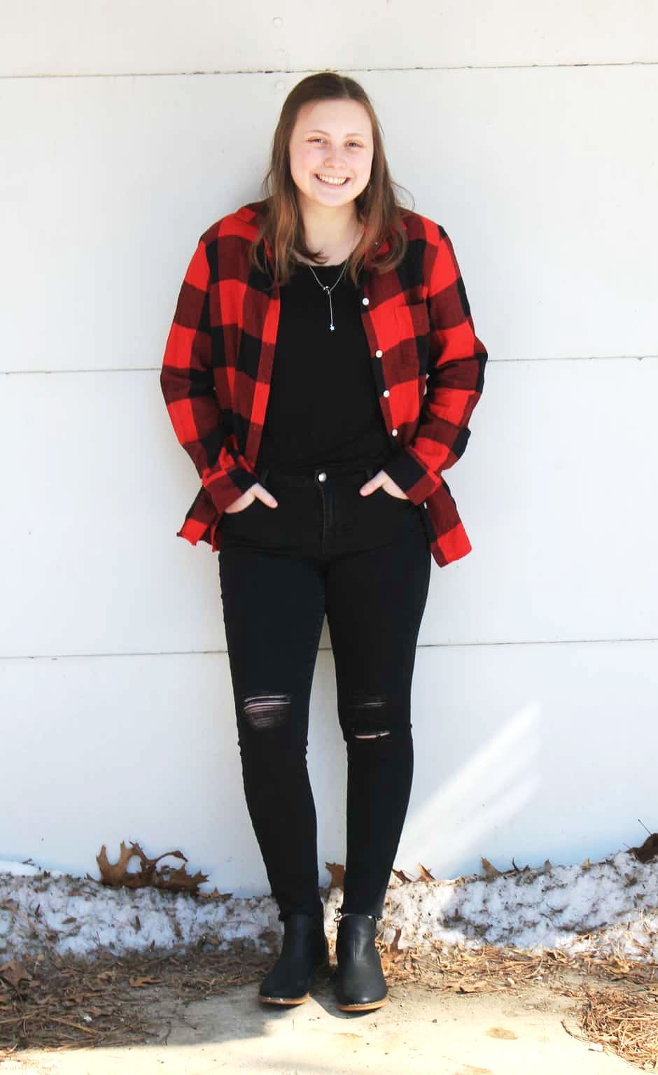 GVSU fashion: Student Genna wears a red and black plaid shirt with ripped black jeans and a black top