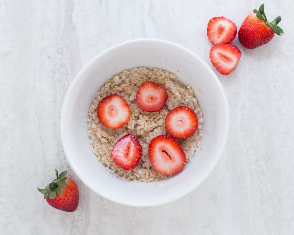 Bowl of oatmeal with strawberries