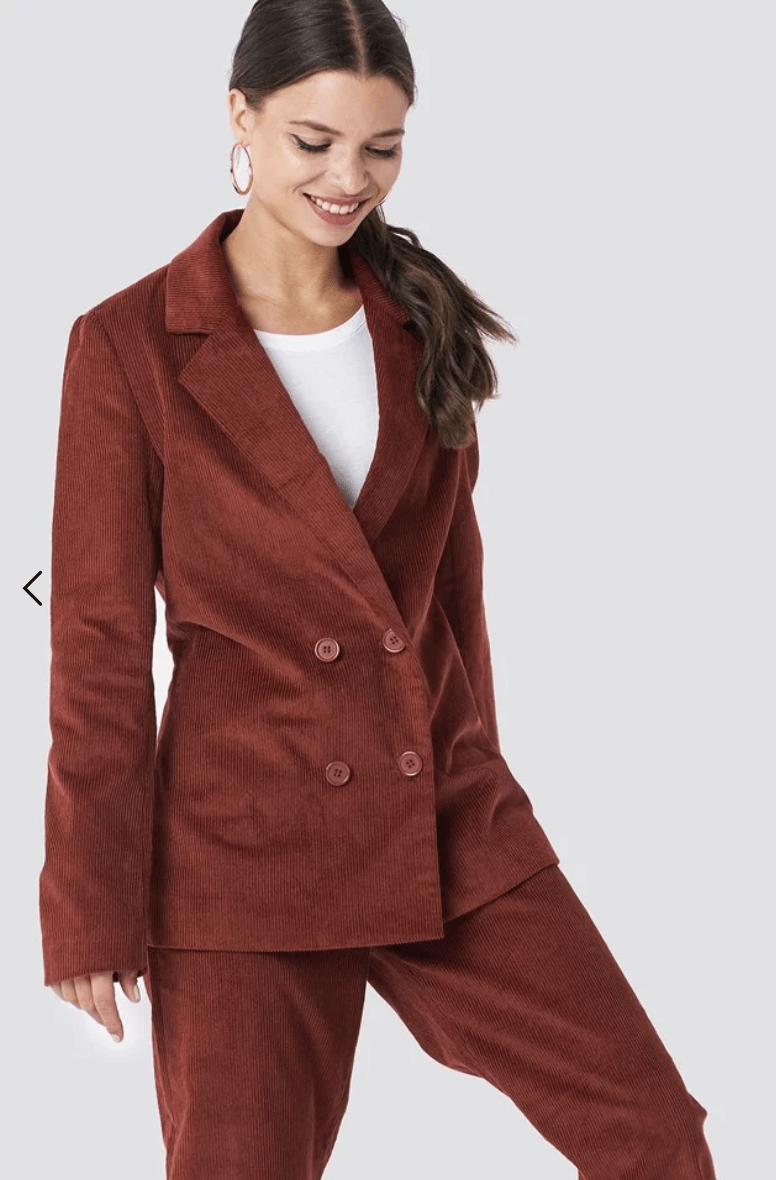 model wearing a brown corduroy suit