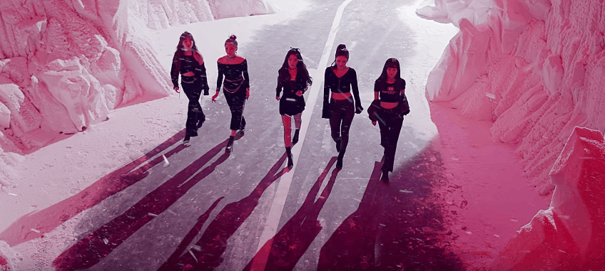 Wendy, Yeri, Irene, Joy, Seulgi walking on the middle of the road during snow with black their black outfit in their bad boy MV.