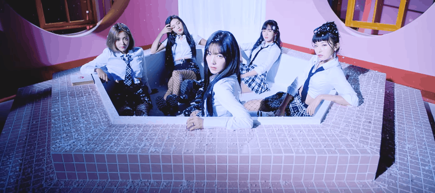 RV members wearing a school uniform inside a tub while snowing