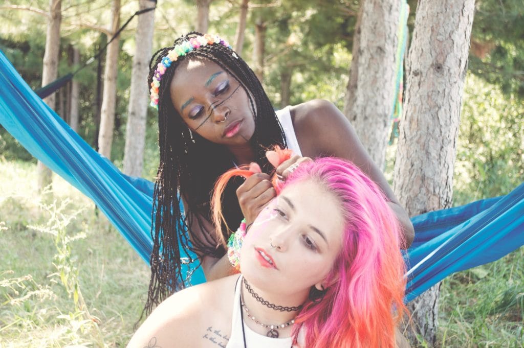 friends braiding pink hair