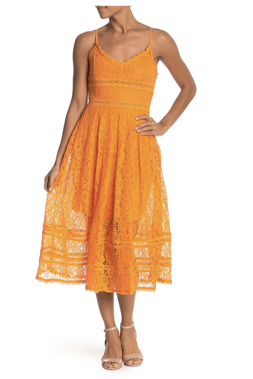 model in orange lacy dress