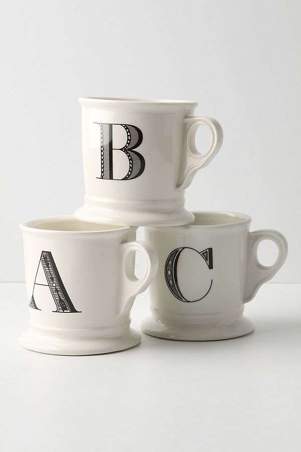 Three off-white monogram mugs featuring capital letters