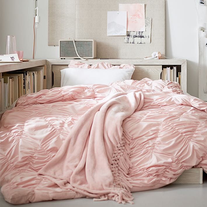 Pink ruffle comforter with pink blanket