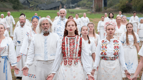 Midsommar movie costumes - swedish commune members wear white embroidered clothing