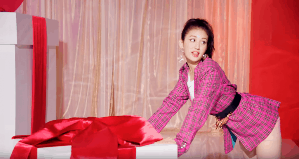 Somi fashion in her Birthday music video - shot of Jeon Somi wearing pink plaid dress