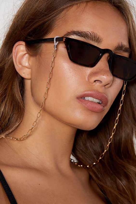 Gold sunglasses chain from Nasty Gal, titled 