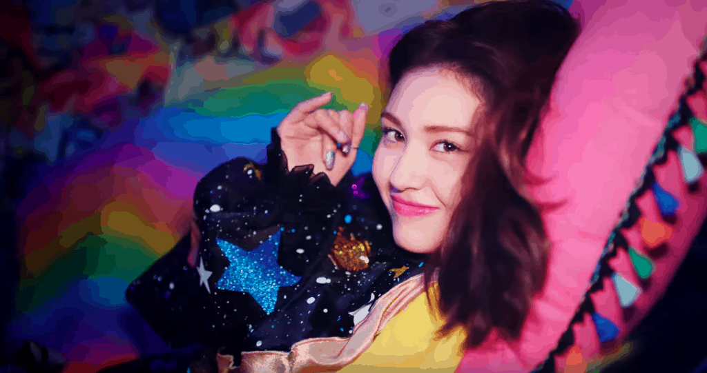 Somi Birthday music video still – Jeon Somi wearing star glitter jumper