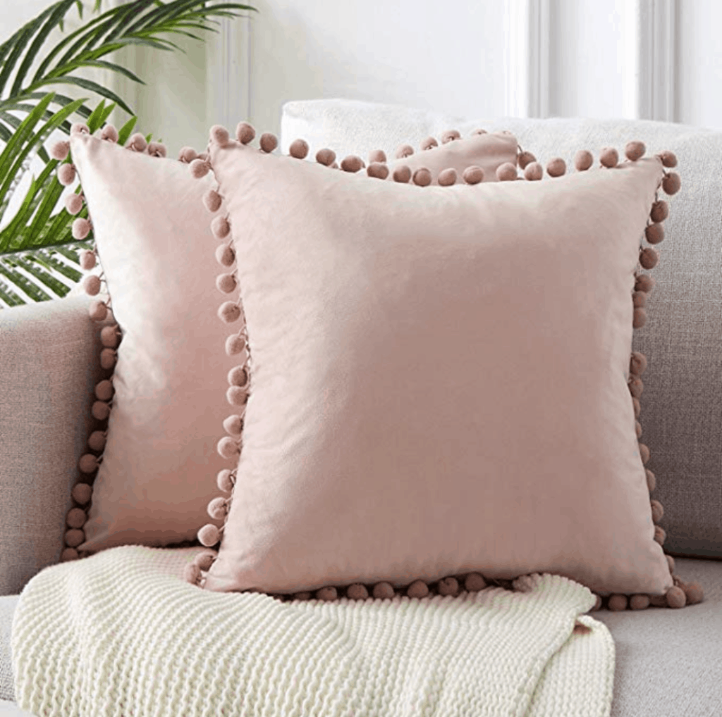 Cute dorm room decorations - pink pom pom pillows from Amazon