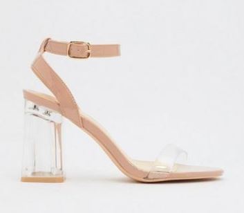 A pair of heeled sandals with a clear heel and strap