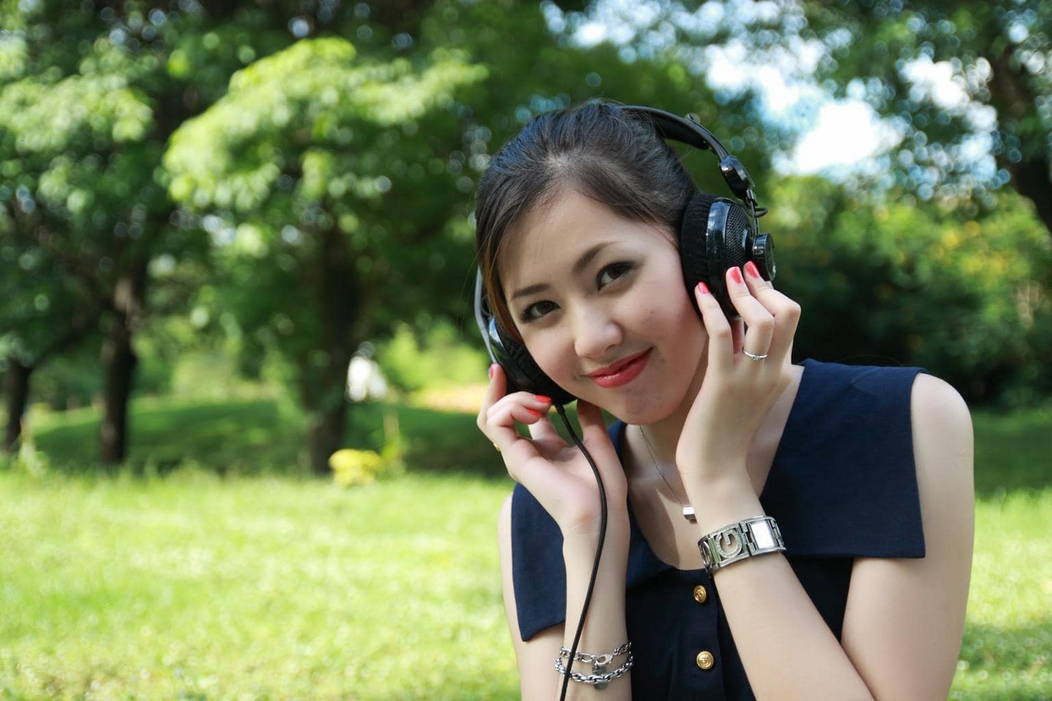 girl listening to music through headphones