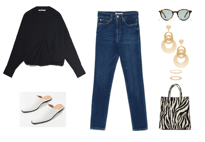 Skinny jeans outfit idea with white mules, black sweater, zebra tote bag, gold jewelry