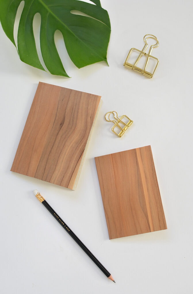 fake wood notebook with metal clips and leaf