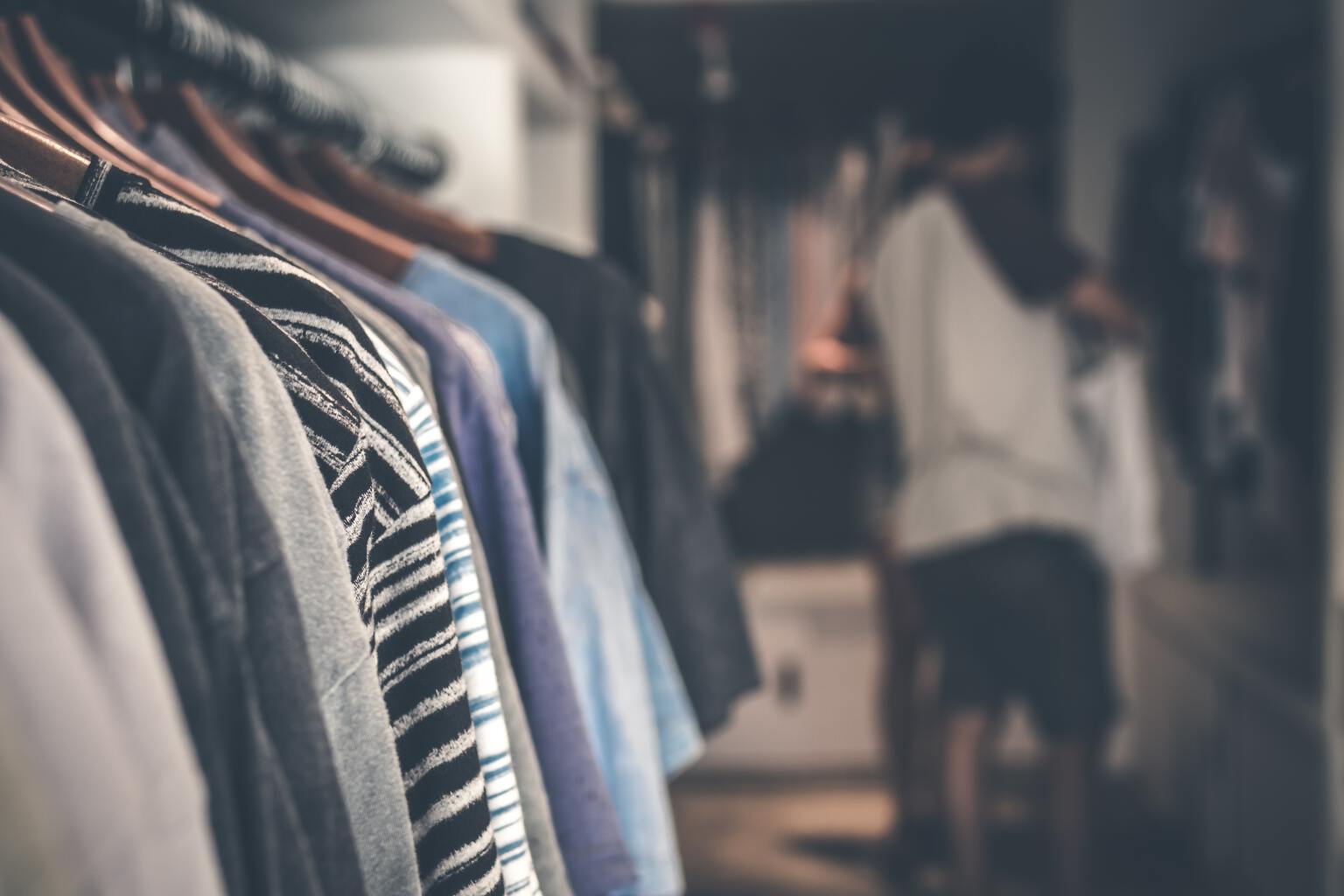 Closet full of mens clothing. 