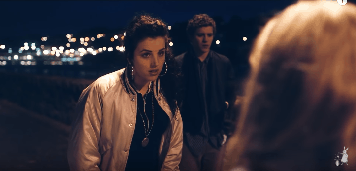 Michelle on Derry Girls wearing a bomber jacket