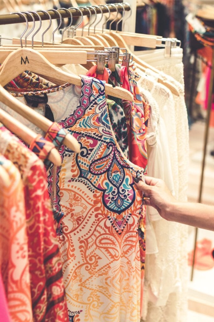 Stock photo of clothes hanging on a rack