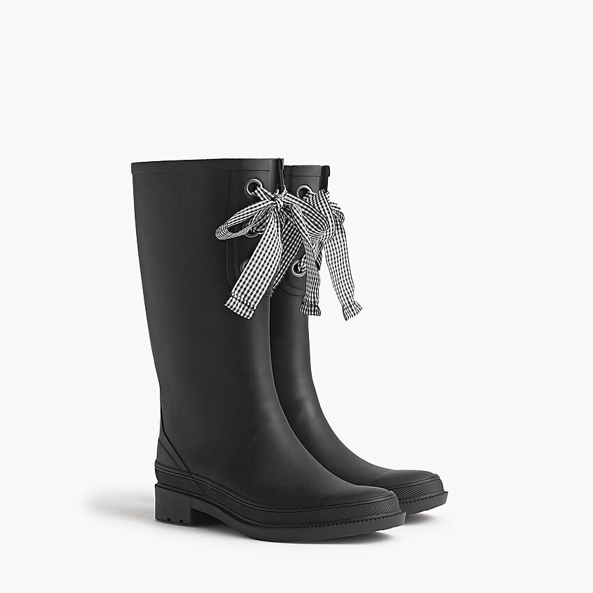 Seven Cute Pairs of Rain Boots to Jazz Up Your Rainy Day Look: J.Crew Tall Lace-Up Rain Boots in black with black-and-white gingham ribbon lace-up detail