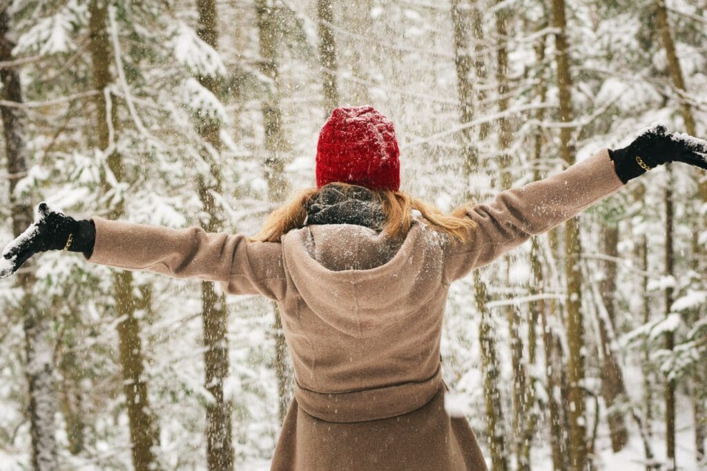 Girl with arms outstretched in snow.