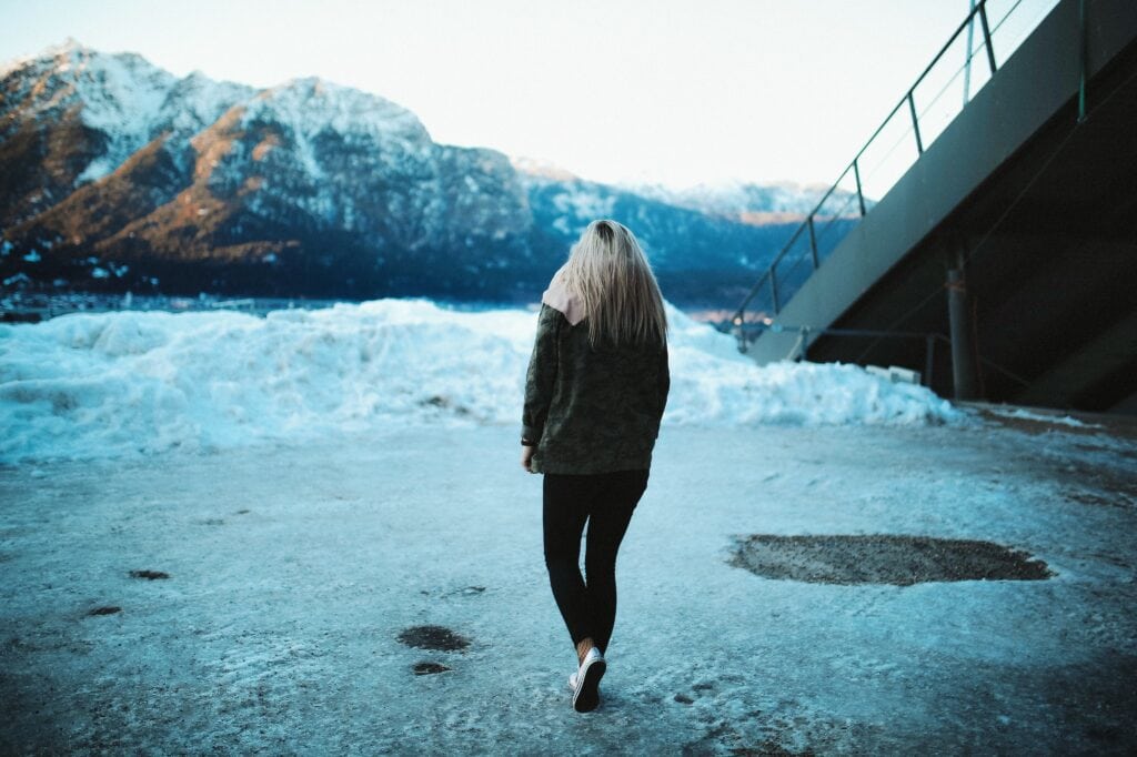 Girl walking in the snow.