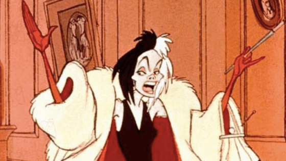 Cruella de Vil in her white and red coat with black dress