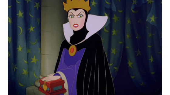 Evil queen fashion - the evil queen in snow white wearing a purple cape and gold crown