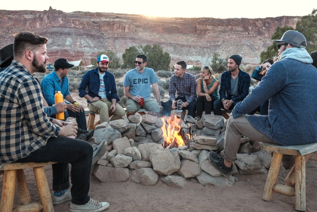 Creating hygge - people sitting around a bonfire