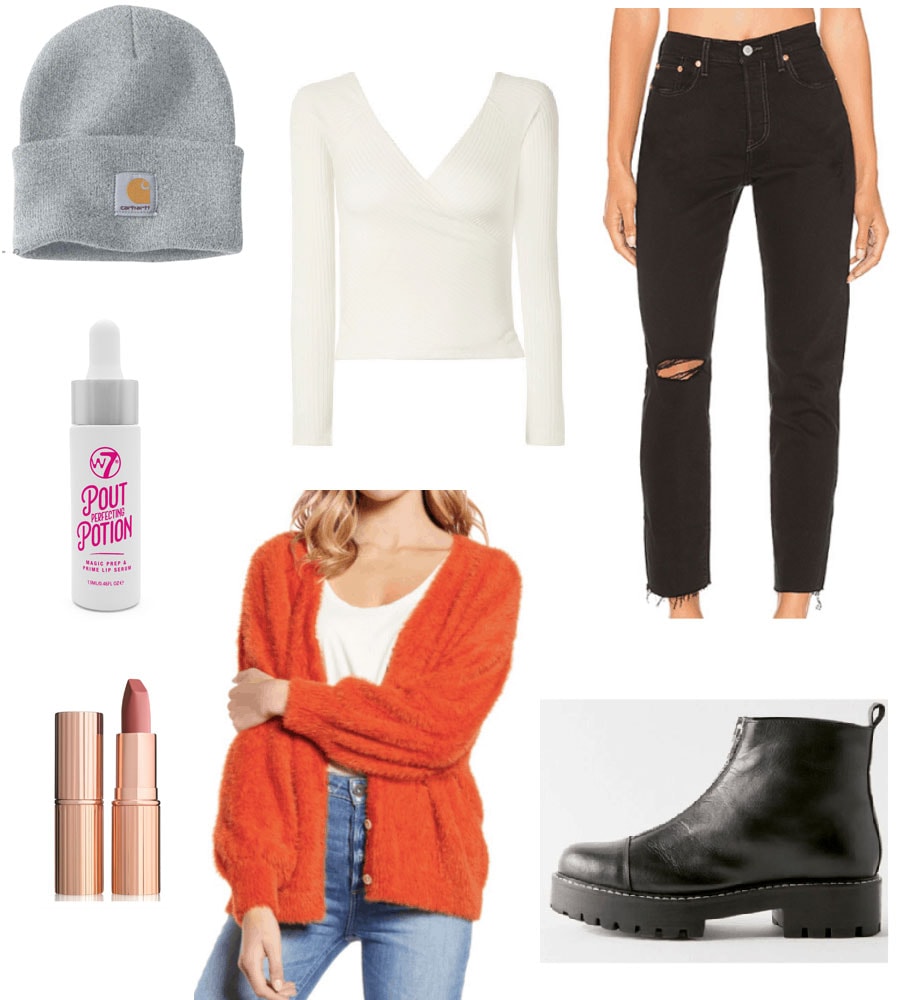 Outfit set with orange cardigan, white top, black jeans and black boots. 