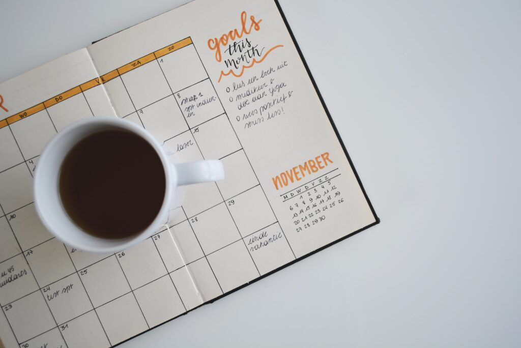 coffee cup on open planner