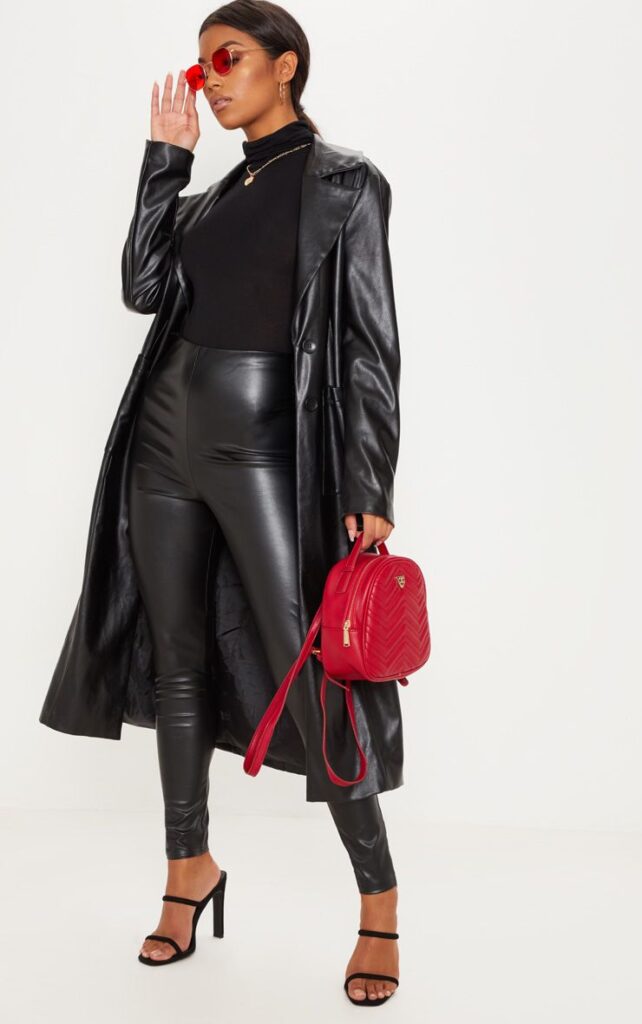 Faux leather leggings paired with a leather trench coat