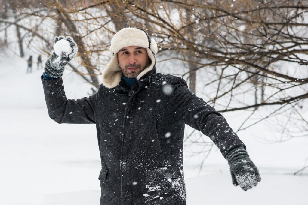 man throwing a snowball