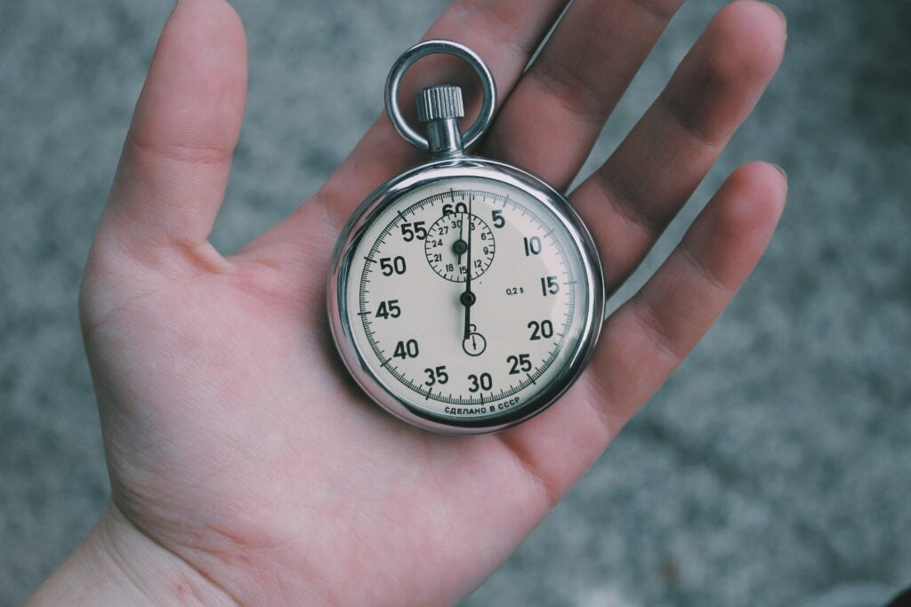 person holding stopwatch