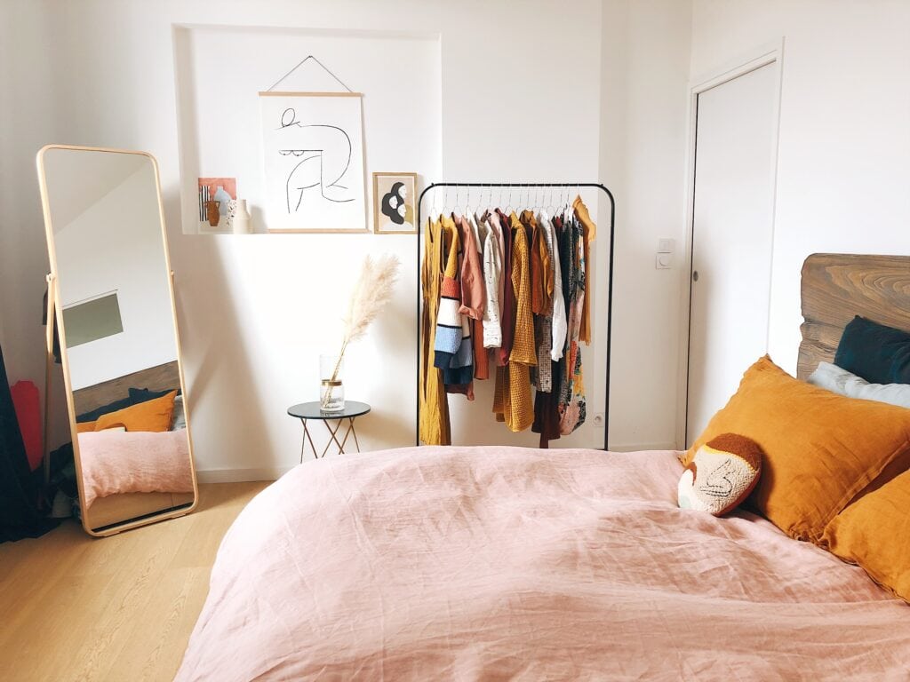 Decluttering tips - bedroom with pink bed