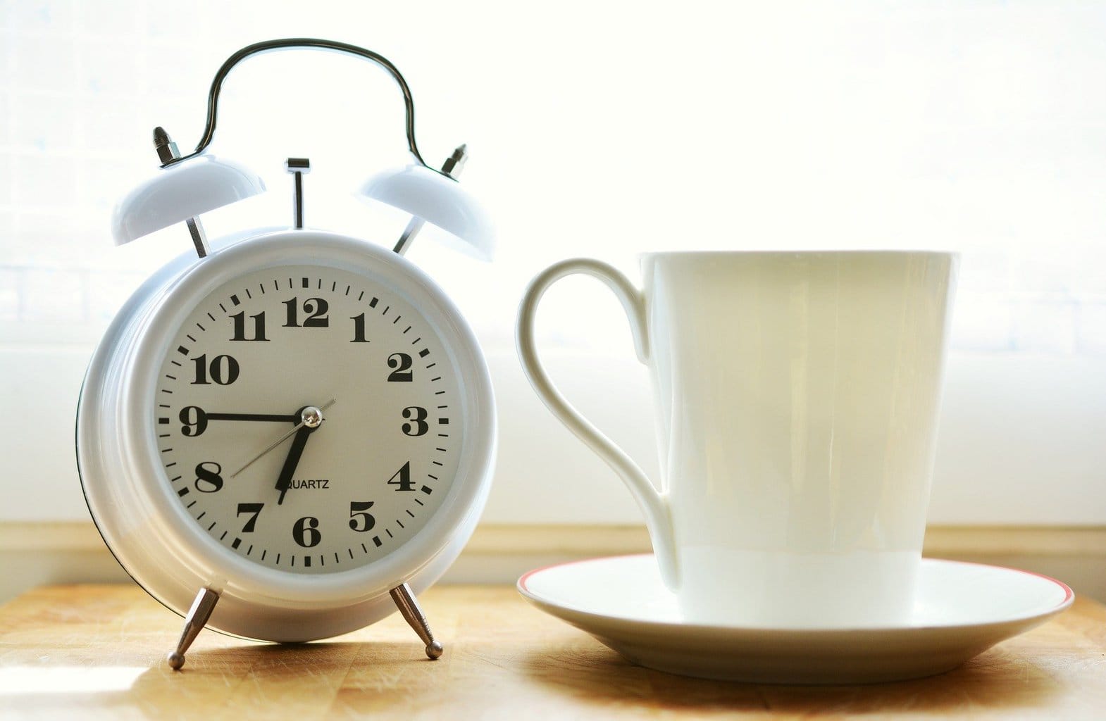 Alarm clock and coffee cup