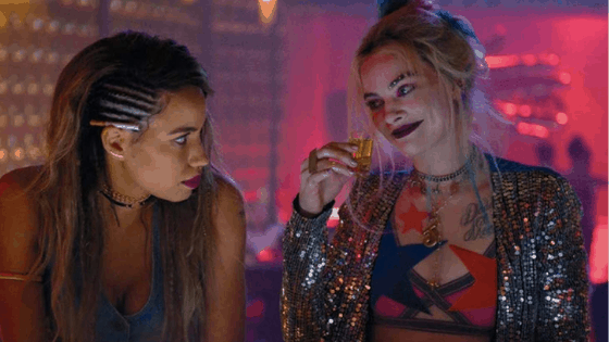 Harley Quinn wearing a sequin jacket at a bar in Birds of Prey