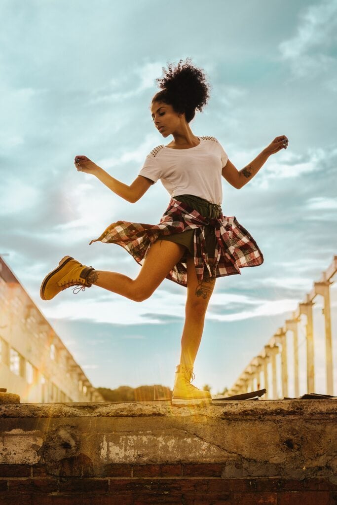 girl dancing on cement stairs - best creative hobbies