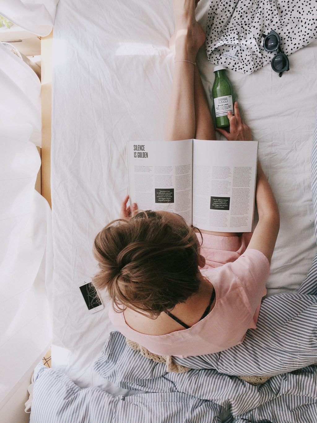Sleeping tips image: woman on bed reading