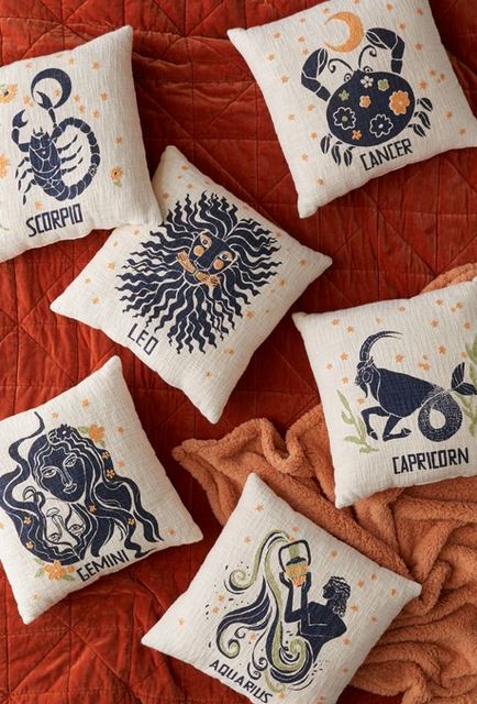 Blue and gold zodiac pillows.