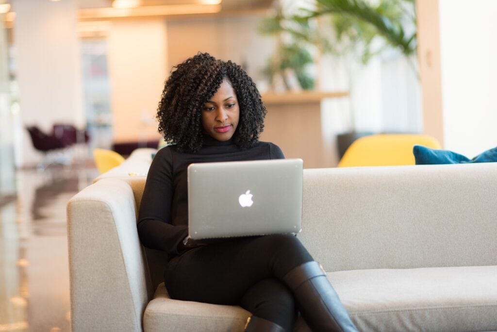 Woman using a laptop to take online classes