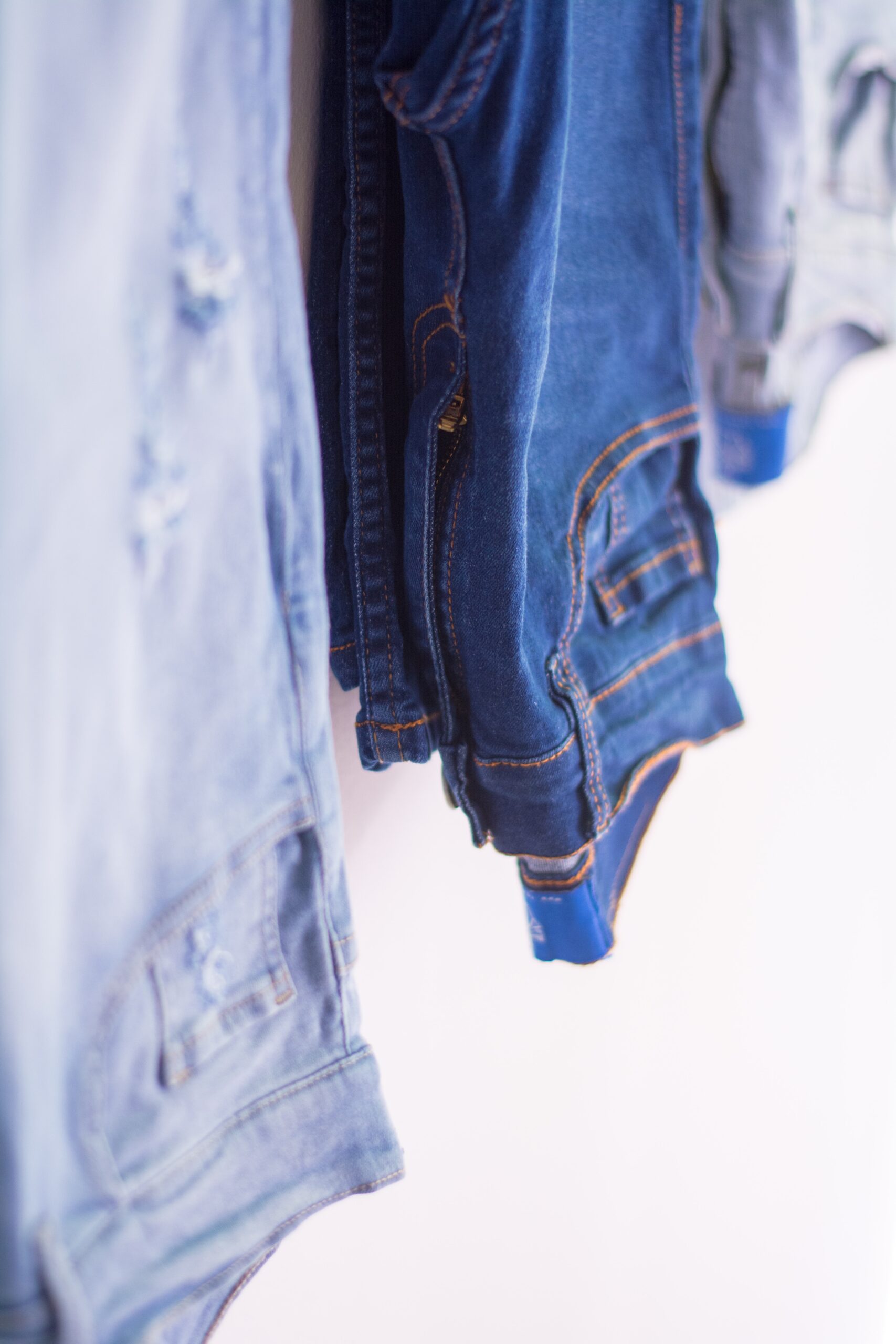 denim jeans hanging on a line