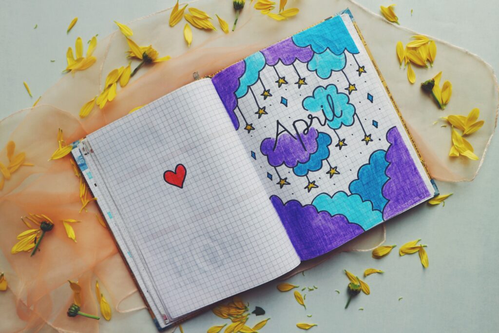 Notebook with drawing ofclouds and stars.